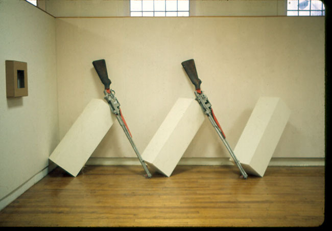 installation, oversized demonstration rifle models and pedestals